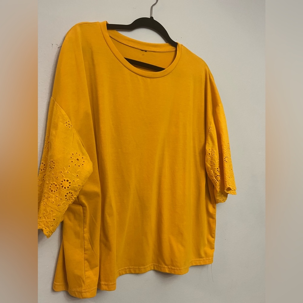 Plus size top with elegant details, perfect for a business or casual o assign.